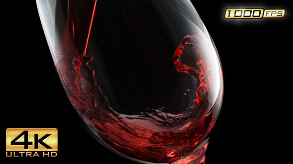 Pouring Red Wine into the Wineglass