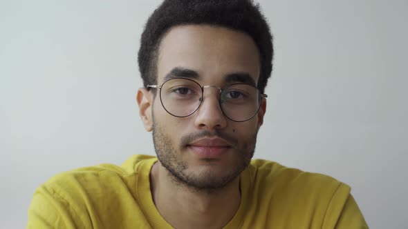 Portrait of a Young Afro Man with Glasses alt