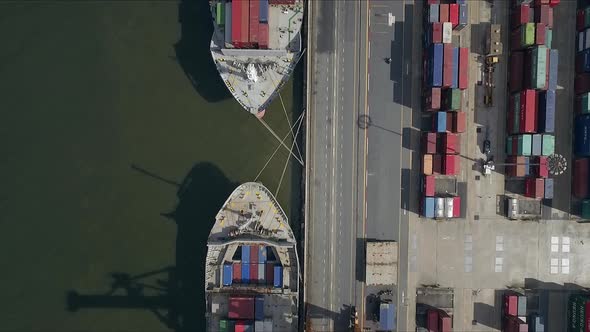 Logistic concept aerial shot of commercial maritime transport dockyard with cargo ships waiting to b alt