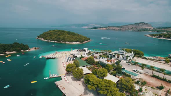Aerial View Azure Beach with Empty Sun Loungers Balkan Coast Ionian Sea Albania alt