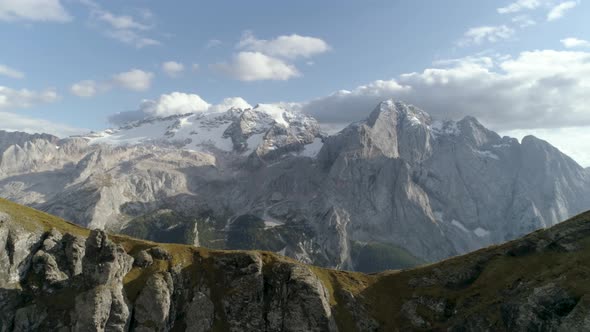 Epic Slowmotion Aerial of the Italian Dolomites covered in Snow during Sunset alt