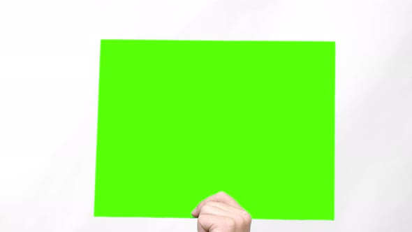 The human hand shows a green screen below, Stock Footage | VideoHive