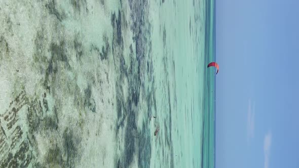 Zanzibar Tanzania  Vertical Video Kitesurfing Near the Shore of Ocean Slow Motion alt