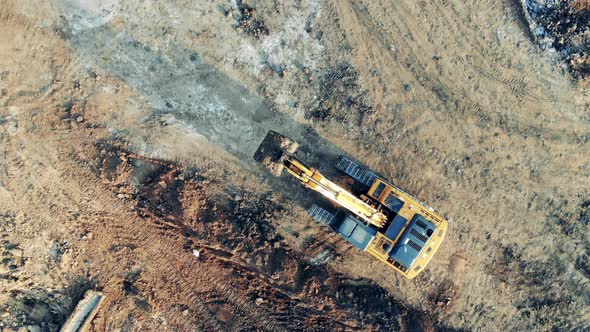 Shoveling Machine Is Riding Along the Extraction Ground alt