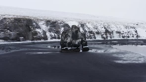 Drone Arcing Round Hvitserkur On Black Sand Beach alt