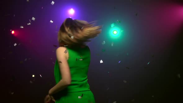Woman in Green Dress Dancing at Party. Close-up. Slow Motion alt