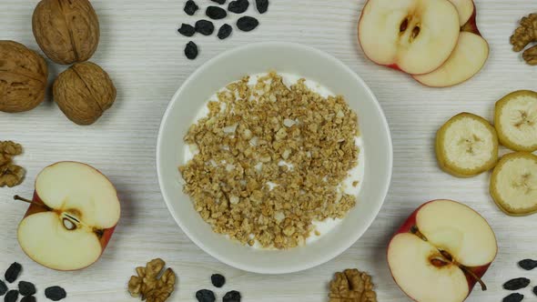 Granola with Yogurt Breakfast. Preparation and Eating. Stop Motion Animation. Top View alt