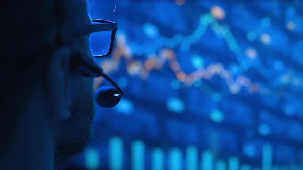 Trader is Working with Multiple Computer Screens with Charts and Data Analysis and Stock Broker alt