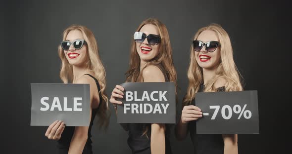 Woman Demonstrating Black Friday Posters