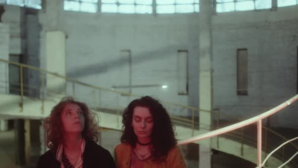 Two Relaxed Girls with Eyes Closed Enjoying Evening alt