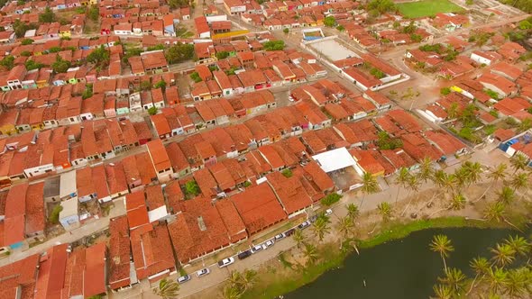 Aerial view of rooftops and small streets of Rio do Fogo town, Brazil. alt