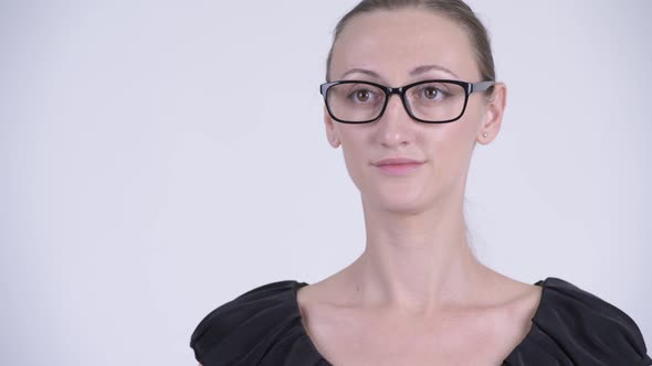 Face of Happy Blonde Businesswoman with Eyeglasses Thinking alt