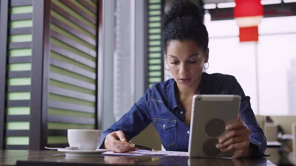 Female Discussing Projects and Finances of Clothing Store in Cafe at Online Video Meeting alt