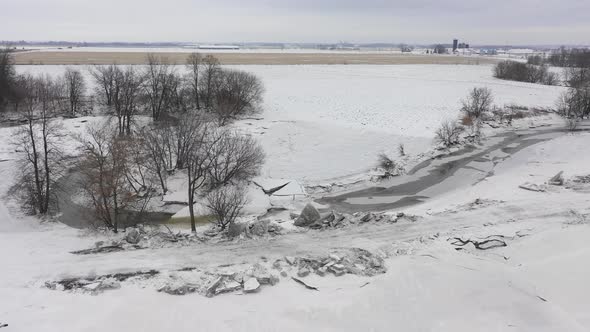 irregular ice build up from creek blocked the road due to global warming alt