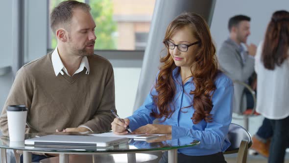 Two young business people meeting