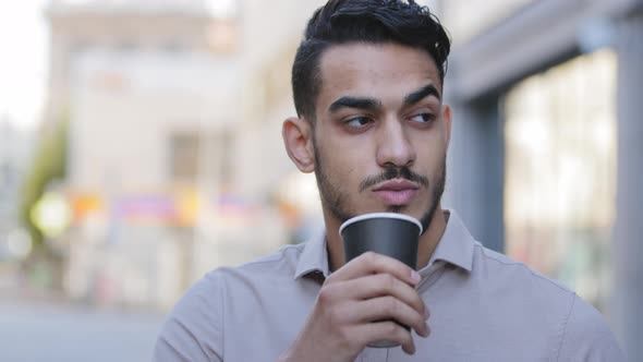 Close Up Portrait Young Bearded Arabian Manstanding in City Street and Looking Around Thoughtfully alt