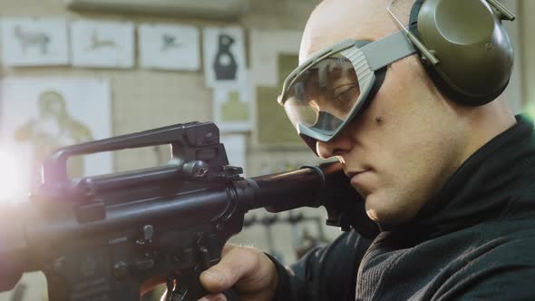 Man Trains To Shoot at the Shooting Range, Closeup alt
