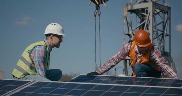 Technicians Installing Solar Panels in Sunshine alt