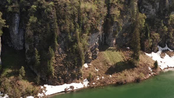 Tilt up of mountain ridge near lake alt