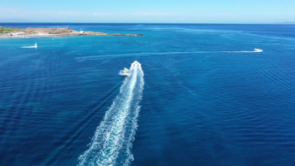 Aerial View of a Motor Boat Towing a Tube. Zakynthos, Greece