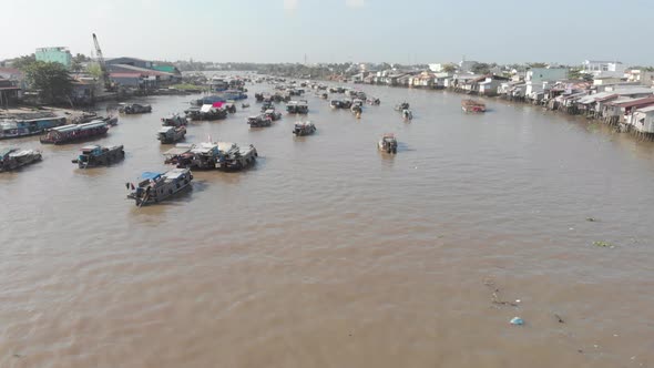 Aerial: rotating panorama over Cai Rang floating market Can Tho Vietnam alt