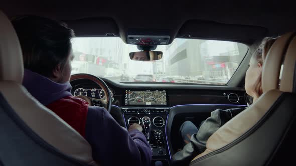 The driver driving the car adjusts the air conditioner grille