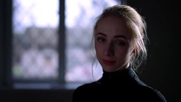 Closeup Young Slim Beautiful Woman Turning Looking at Camera in Backlit alt