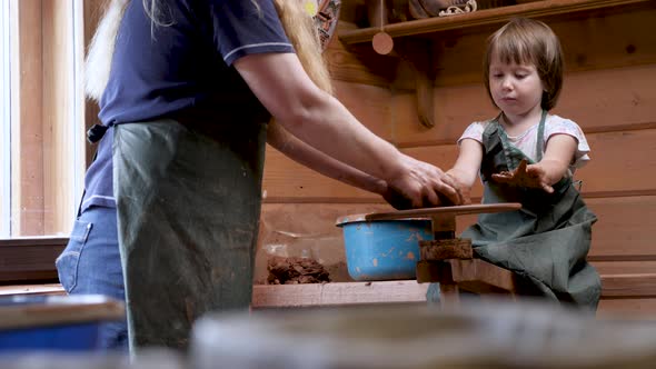 Ceramic Potter Teaches Child Crafts