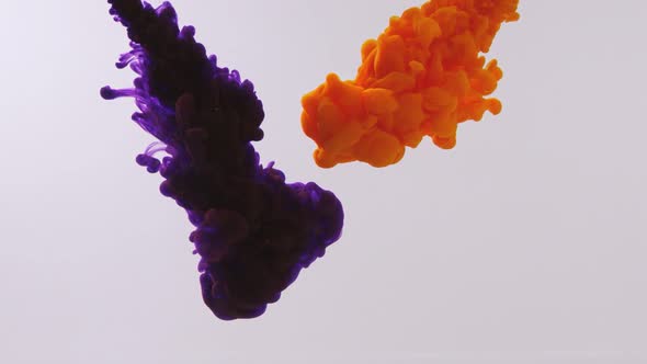 Mixing of Purple and Orange Paints in the Water