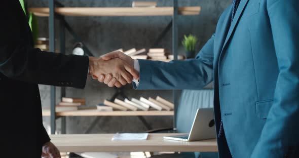 Closeup Hands of Top Managers Shaking Hands with Each Other at Modern Office alt