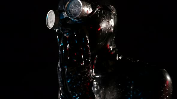 Closeup of a Head in a Black Latex Helmet and Glasses alt