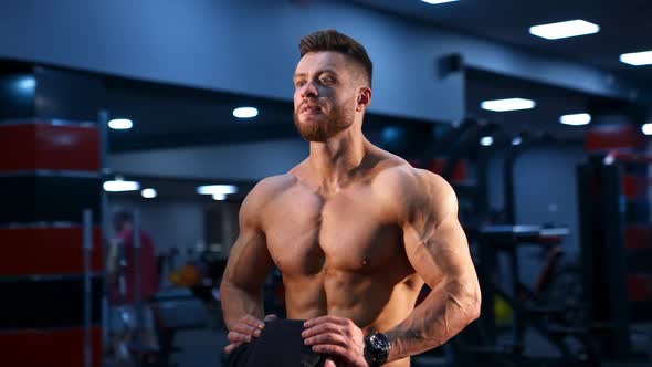 Circle view on handsome male bodybuilder with strong body and perfect abs. Male with naked torso.  alt