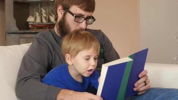 Father and Son reading a book together