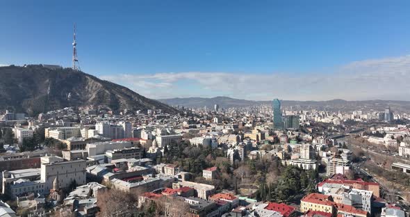 Tbilisi, Georgia - February 1, 2022: Aerial view of center of Tbilisi under Mtatsminda mountain. alt
