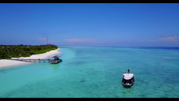 Aerial landscape of luxury shore beach holiday by transparent lagoon and white sandy background of j alt