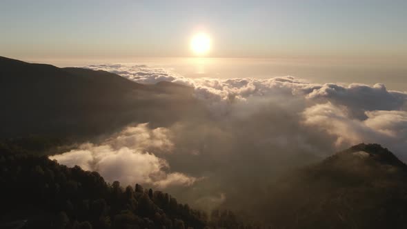 Beautiful aerial view above the clouds on sunset. Gomismta, Georgia alt