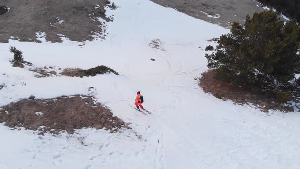 An Aerial-looking Skier in an Orange Suit Makes a Kicker Jump in the Spring When There Is Little alt