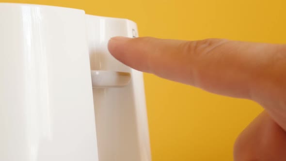 Handle lowering on two-slot automatic electric toaster slow-mo footage alt