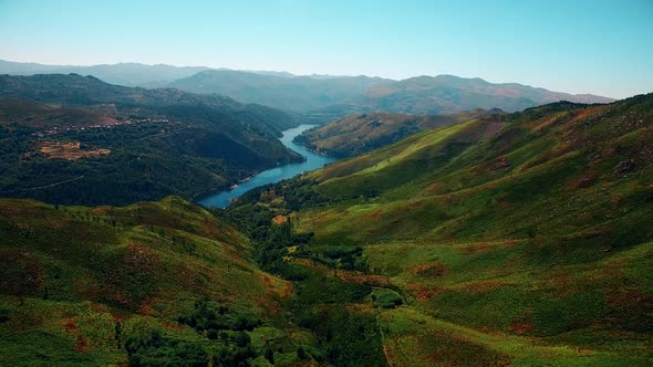 Stunning Landscape Of Mountain Pass With Lush Green Meadow and Stream At Daytime alt