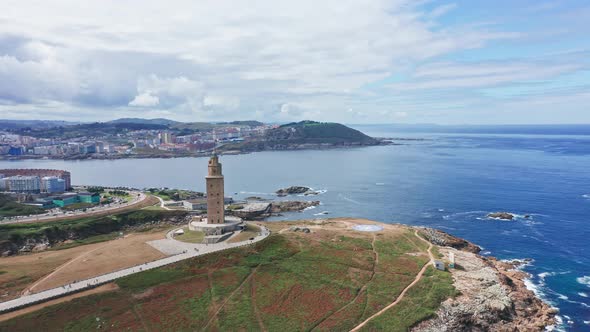 Aerial towards Historic Hercules tower la Coruña Coastline Background, North of Spain alt