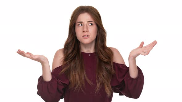 Portrait of Caucasian Woman Throwing Up Hands in Rejection Meaning Not Know or What's Going on alt