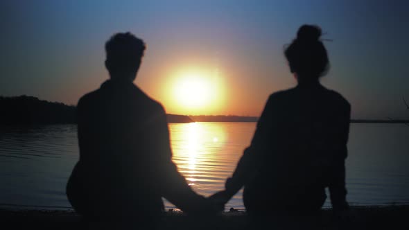 Couple Hold Hands on Sunset Relaxing