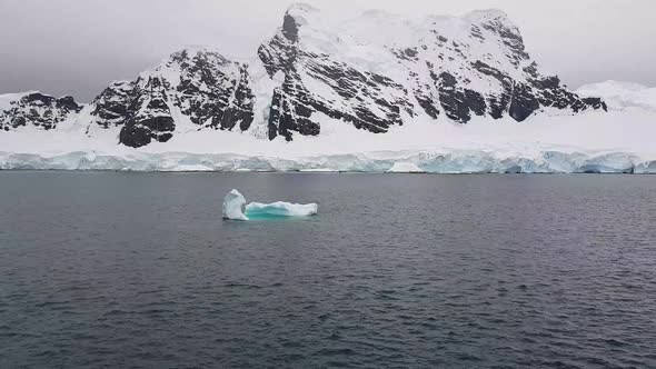 Small Iceberg Floating on Dark Water alt