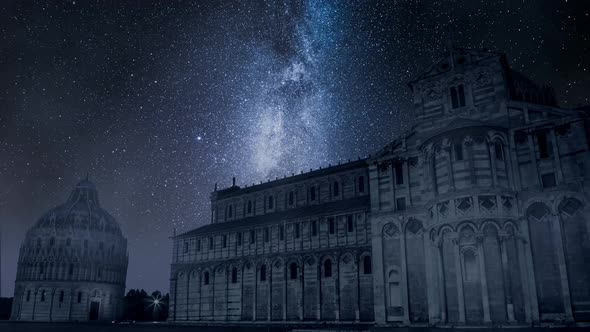 Milky way and falling stars over monuments in Pisa, timelapse alt