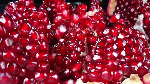 Closeup of Pomegranate Grains Falling in Super Slow Motion alt