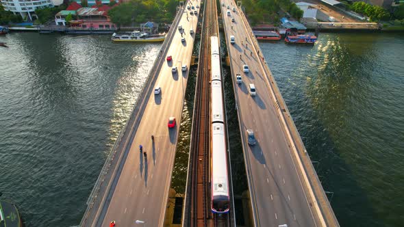 4K : Drones fly over the Chao Phraya River. Aerial view over bts skytrain alt