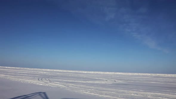 View From a Hovercraft Window While Driving on The Snow Covered Lake Baikal