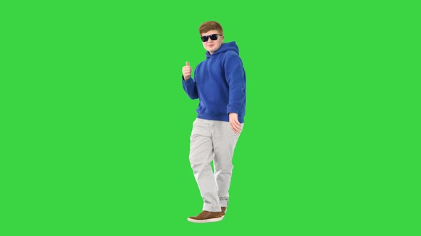 Casual Boy in Sunglasses Walking and Dancing on a Green Screen, Chroma Key alt