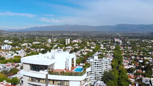 Rooftop Swimming pool Skyscrapers Apartments Andes Mendoza Argentina aerial view alt