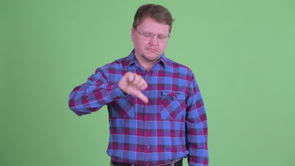 Sad Overweight Bearded Hipster Man Giving Thumbs Down alt